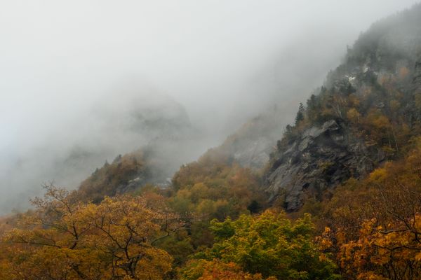 Clouds rolling down from the mountain peaks.