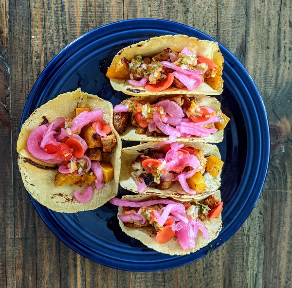 A color plate of tacos.